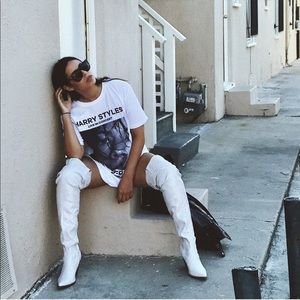 Knee high white snakeskin boots